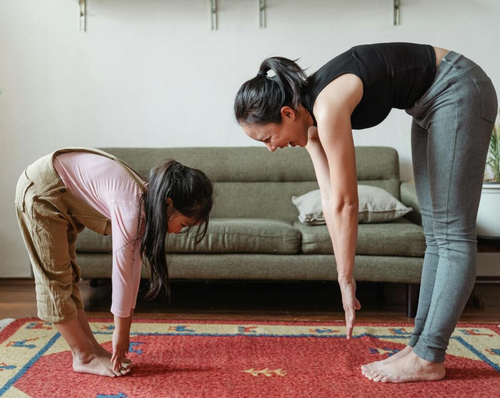 Mother and daughter stretching and practicing healthy habits